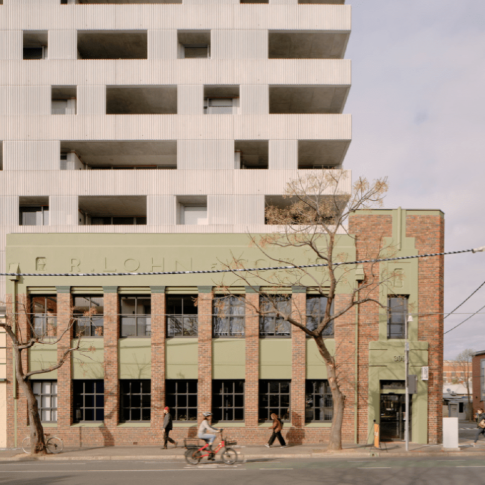 Beige brick appartment builidng with grey skies