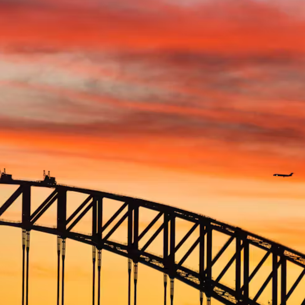 Plane flying over the Harbour Bridge