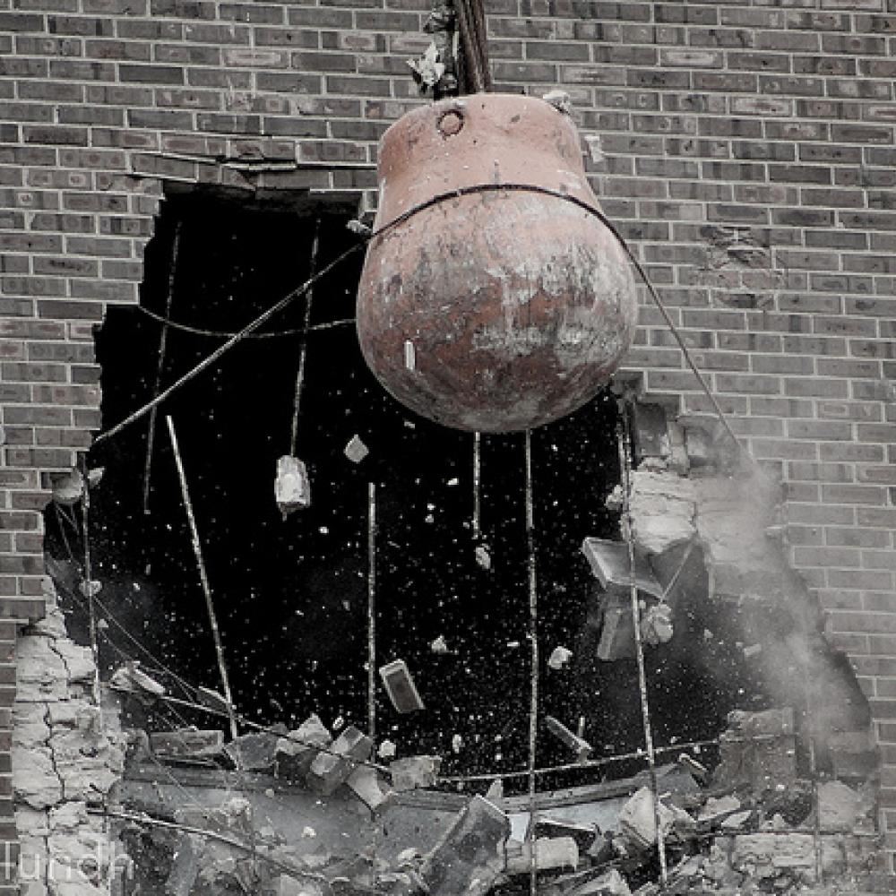 Wrecking ball smashing a wall
