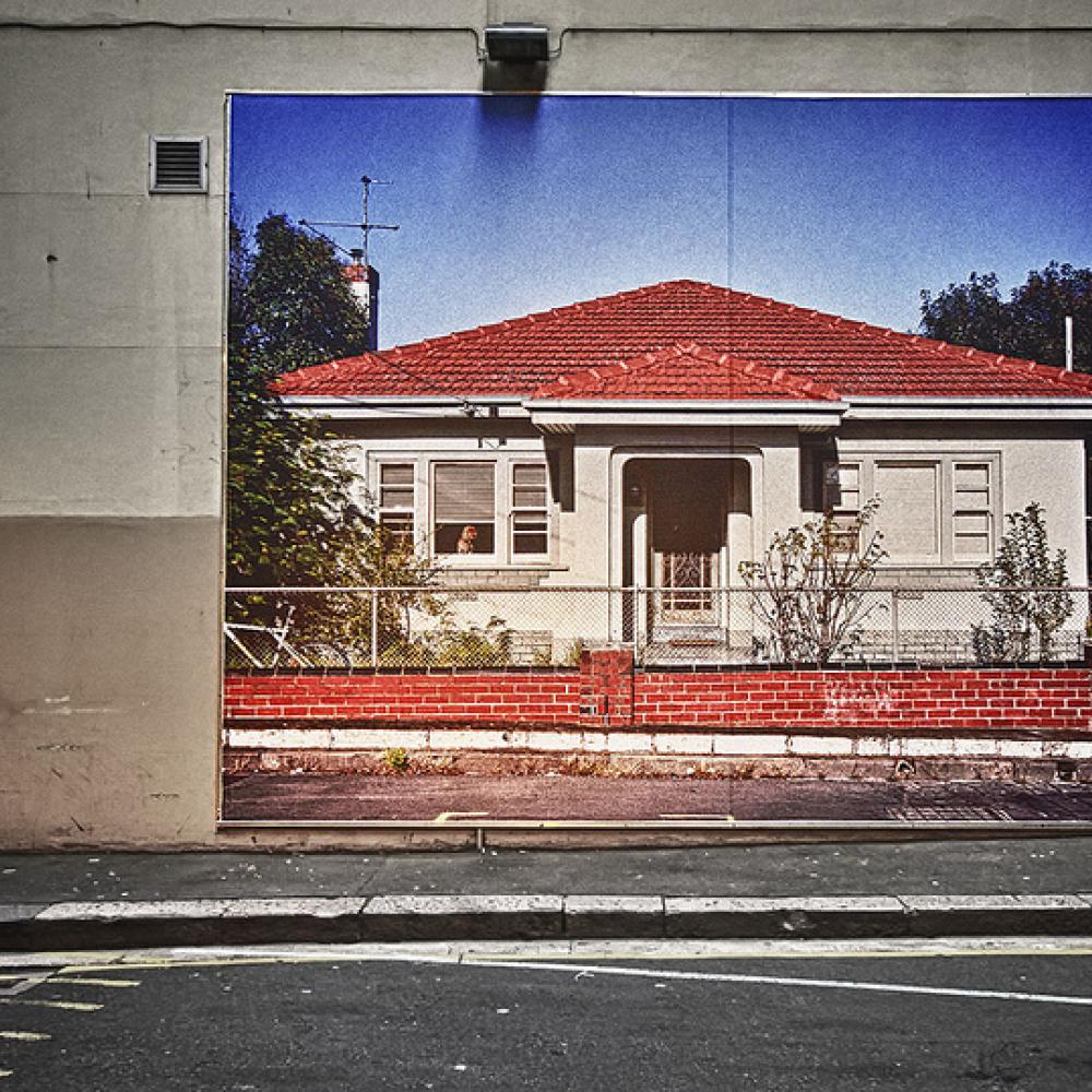 Painting of a house on a wall