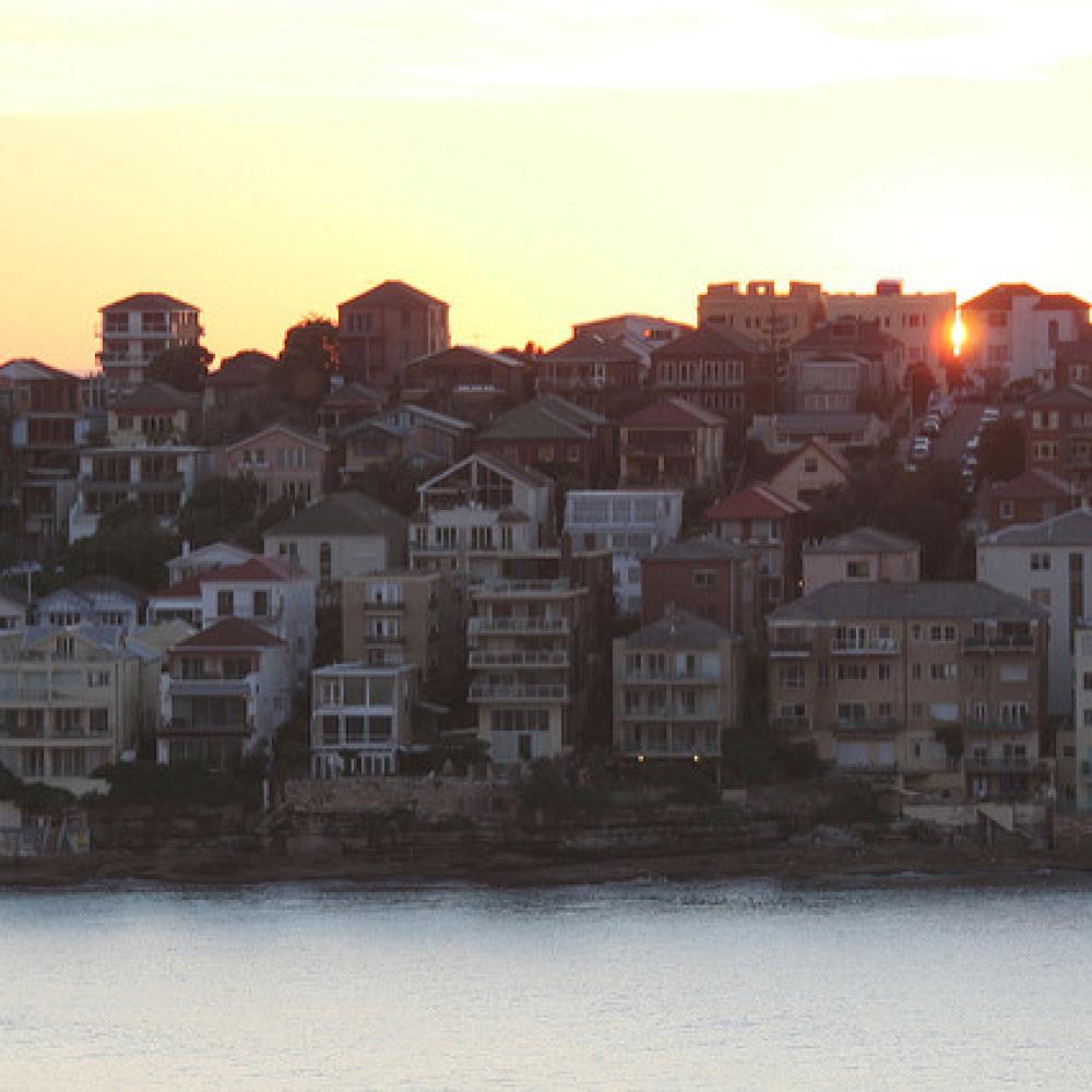 Sunset over a town over a lake