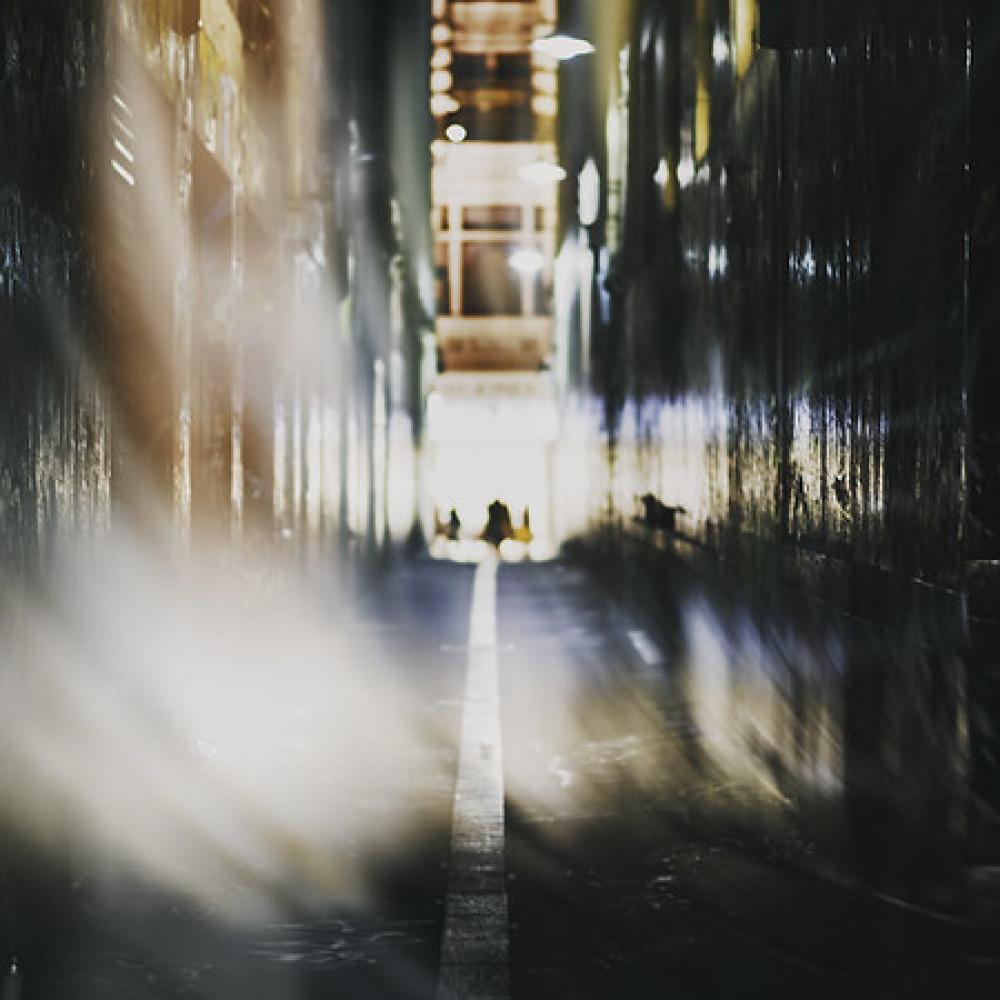 Blurry image of an alley way