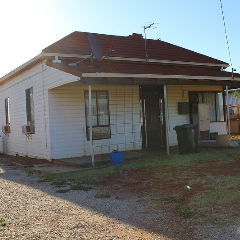 Small house with sun in background