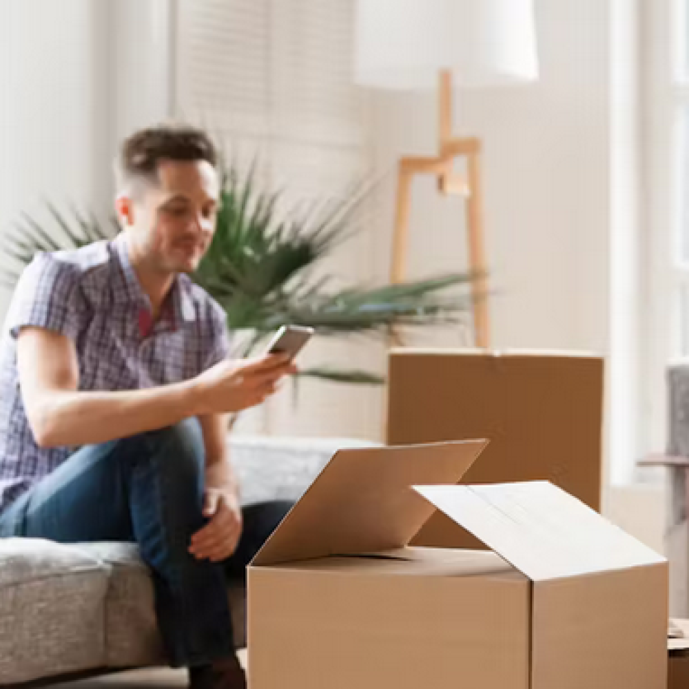 Man happily moving into a home