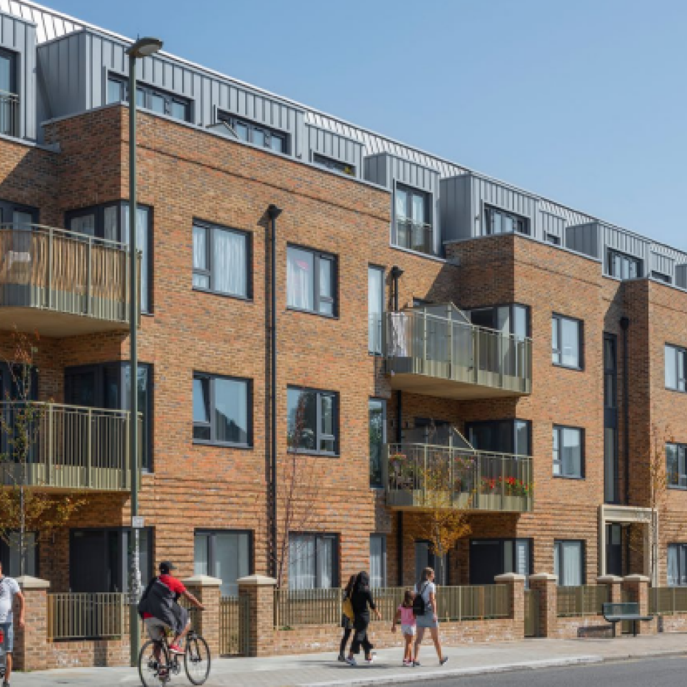 Brick 3 story buildings with busy walkers